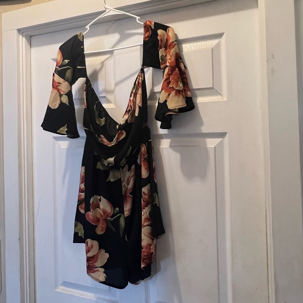 NWOT. Black flowy floral off the shoulder 3/4 sleeve romper. - Picture 7 of 11